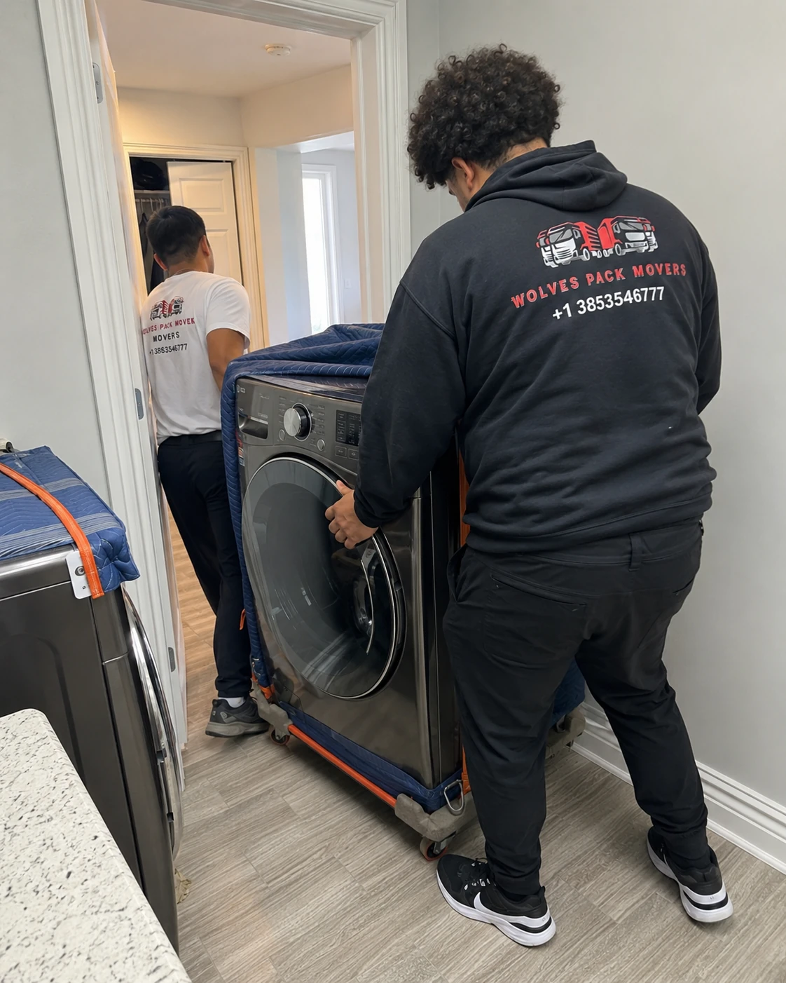 Washer and dryer moving service in Utah disconnecting a front-load washer