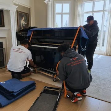 Upright piano secured on a skid board by Oregon piano movers