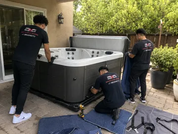 Hot tub removal service Utah loading a spa