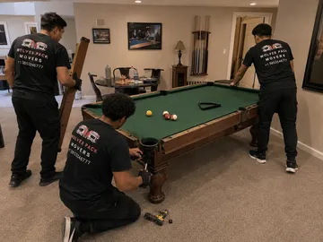 Wolves Pack Movers disassembling a slate pool table in Utah