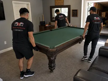 Pool table setup with new green felt by Utah pool table movers