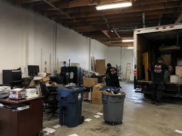 Office furniture loaded into a Wolves Pack Movers truck in Utah