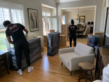 Boxes and protected furniture during an estate cleanout in Utah