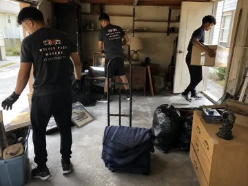 Moving truck loaded with bins and boxes during a Utah estate cleanout