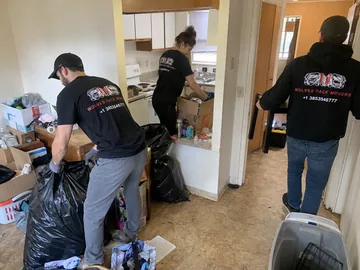 Apartment living room furniture removal during a Utah eviction cleanout