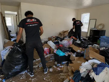 Backyard junk removal at a Utah rental property