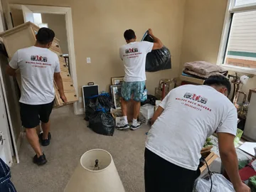 Professional house cleanout team clearing entire home