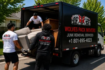 Junk removal company crew loading a truck in Utah